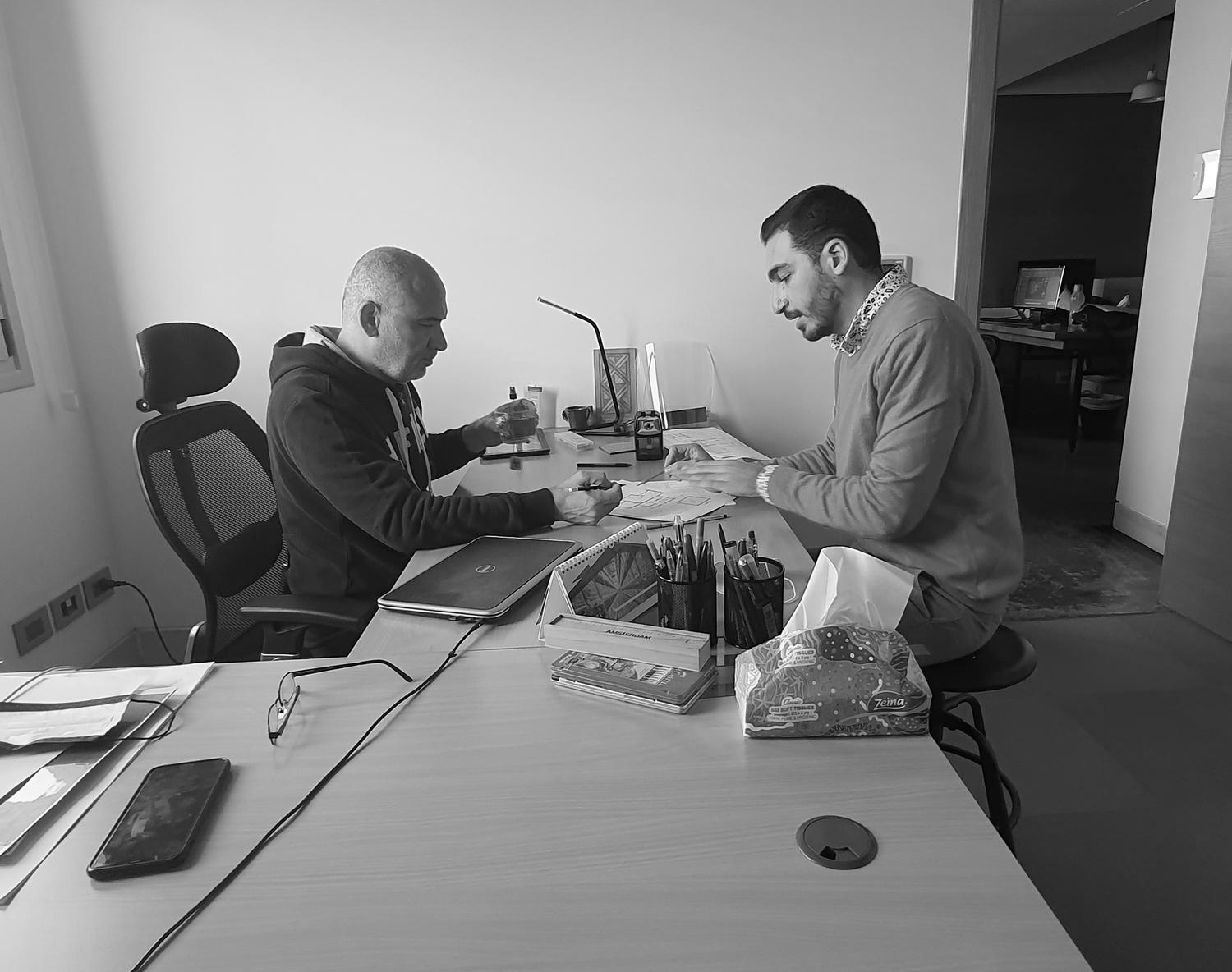 Reviewing drawings at the desk